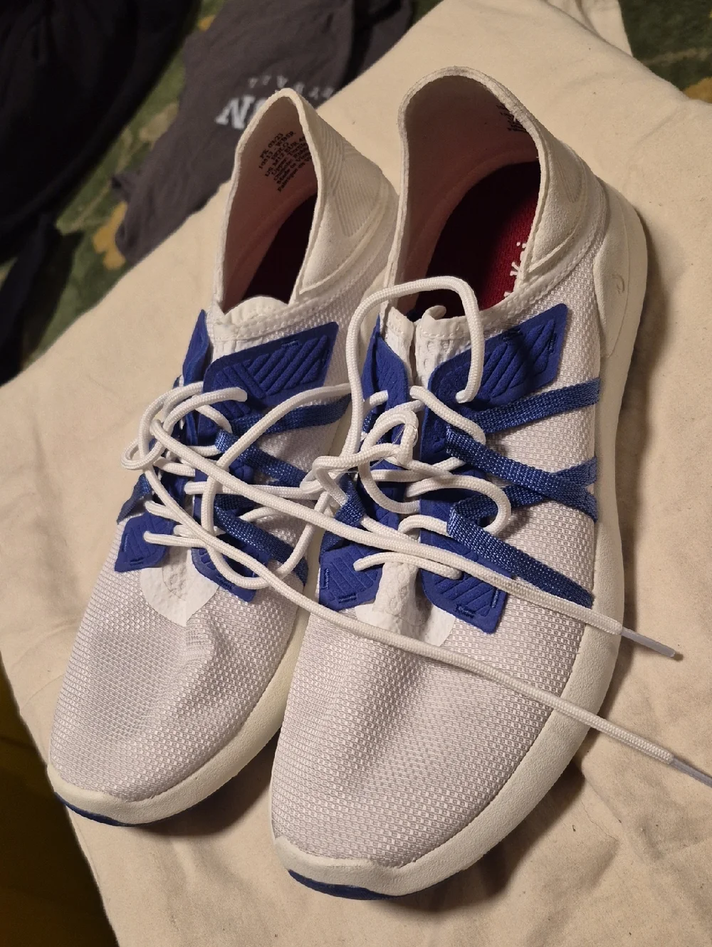 OluKai White Sneakers with Blue Webbing Accents